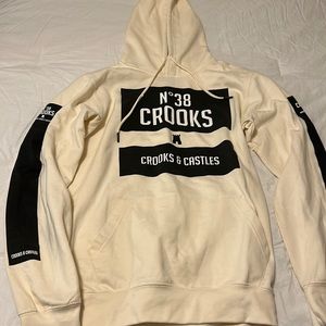 Cream and black colored crooks and castles hoodie